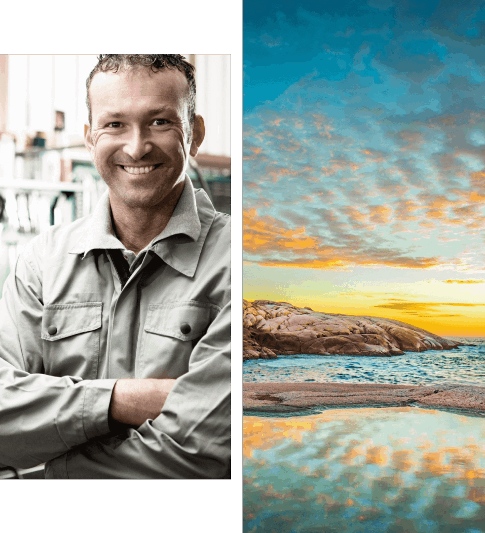 Smiling man and scenic ocean sunset view.